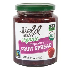 Field Day Organics fruit spread jar with a green lid.